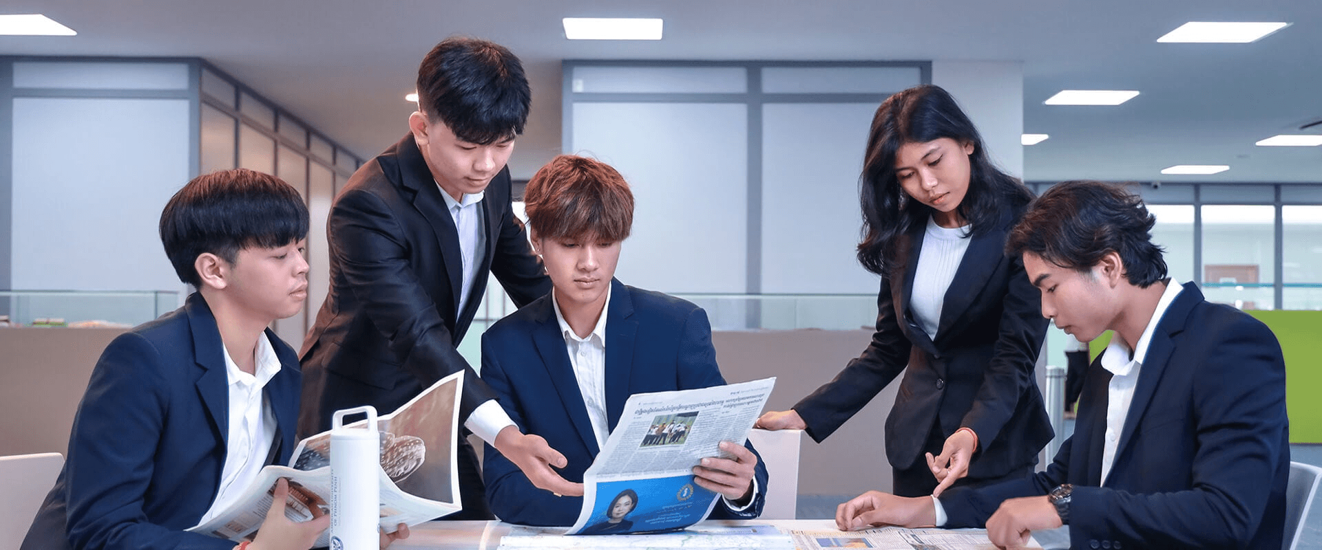 Students collaborating in a professional setting